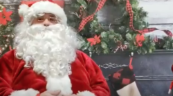 Santa shares a story with Horace May students.