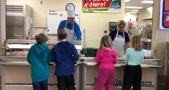 Mr. Luksik serving lunch